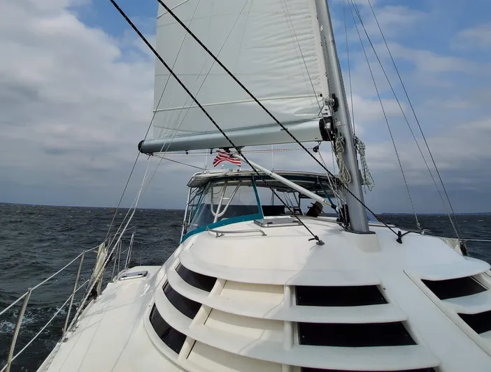 Storyteller Yacht Photos Pics 2007 Manta 42 Mk IV sailing catamaran on open sea with sails up.