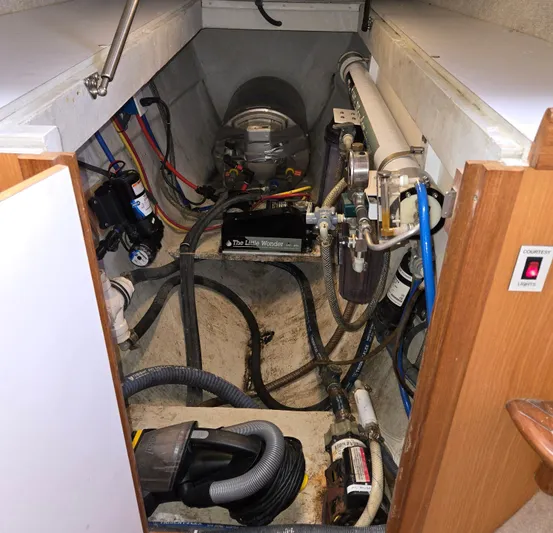 Storyteller Yacht Photos Pics Engine room of a 2007 Manta 42 Mk IV sailing catamaran, showcasing mechanical components.