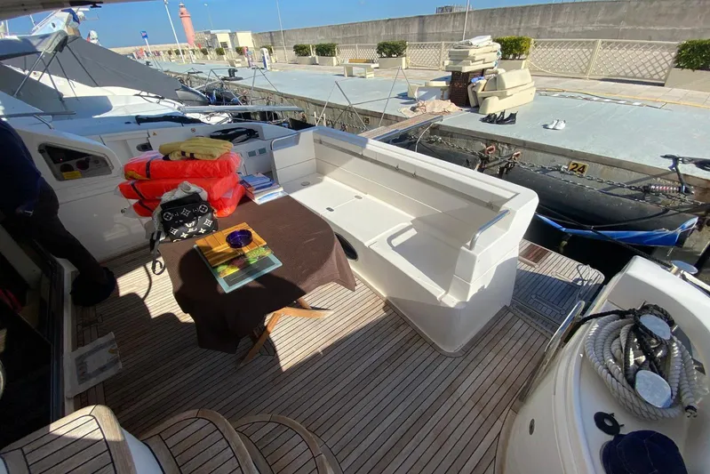  Yacht Photos Pics Azimut 58 yacht deck, 2011 model, with seating and table setup.