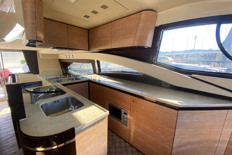  Yacht Photos Pics Luxurious kitchen interior of 2011 Azimut 58 yacht with modern amenities.