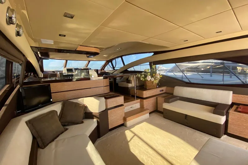  Yacht Photos Pics Luxurious interior of 2011 Azimut 58 yacht with elegant seating and panoramic windows.