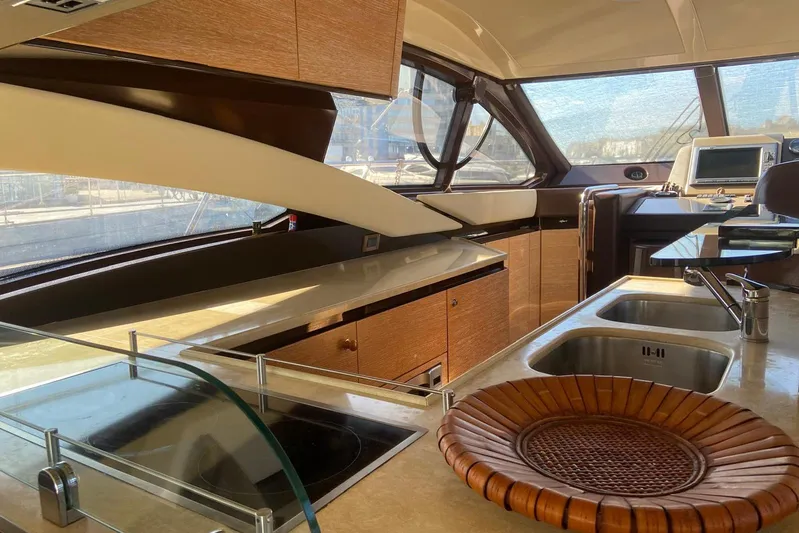  Yacht Photos Pics Luxurious interior of a 2011 Azimut 58 yacht with modern kitchen amenities.