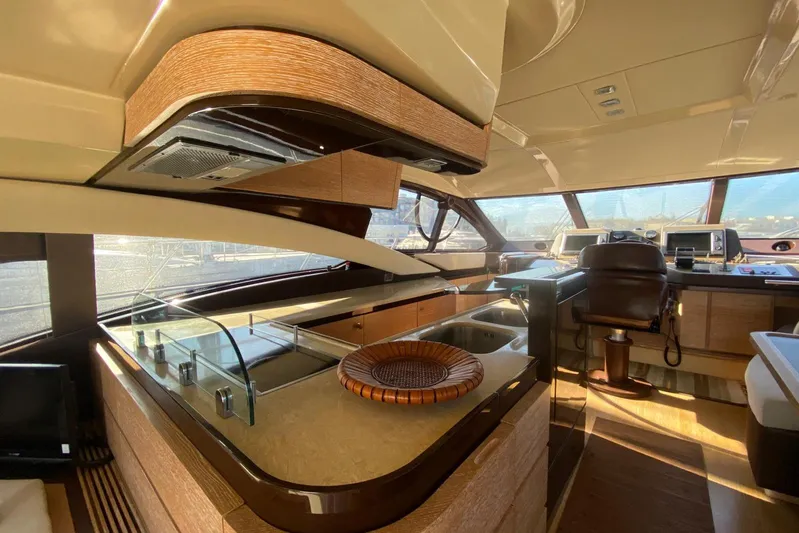  Yacht Photos Pics Luxurious interior of a 2011 Azimut 58 yacht with modern kitchen and helm station.