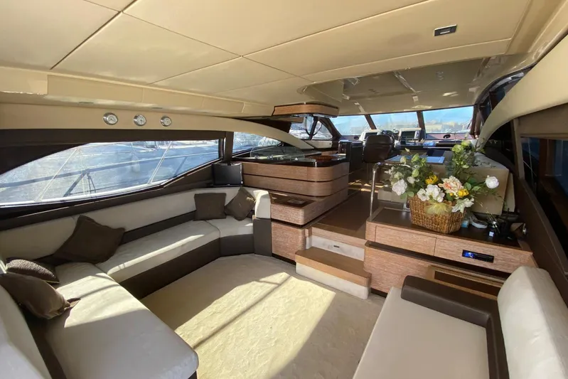  Yacht Photos Pics Luxurious interior of a 2011 Azimut 58 yacht with elegant seating and floral arrangement.
