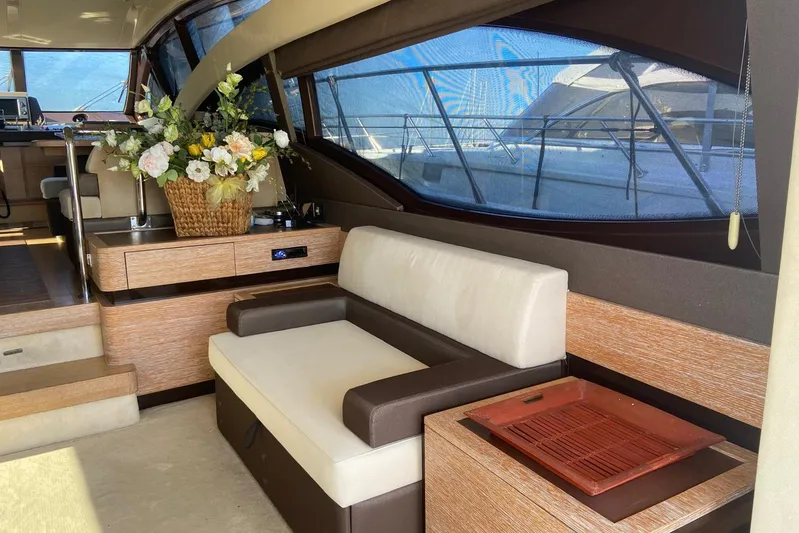  Yacht Photos Pics Luxurious interior of 2011 Azimut 58 yacht with elegant seating and floral arrangement.