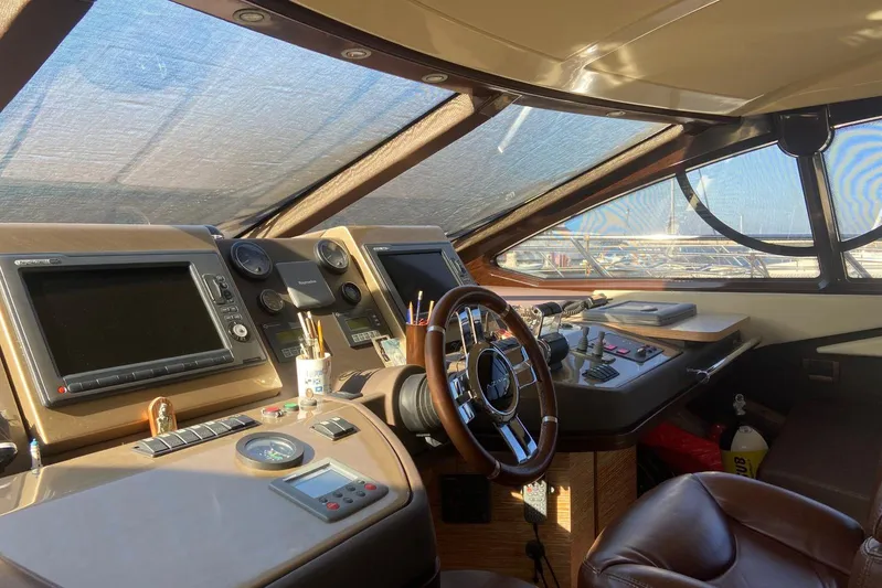  Yacht Photos Pics Cockpit of 2011 Azimut 58 yacht with navigation equipment and steering wheel.
