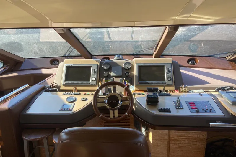  Yacht Photos Pics Cockpit of 2011 Azimut 58 yacht with navigation controls and dual screens.