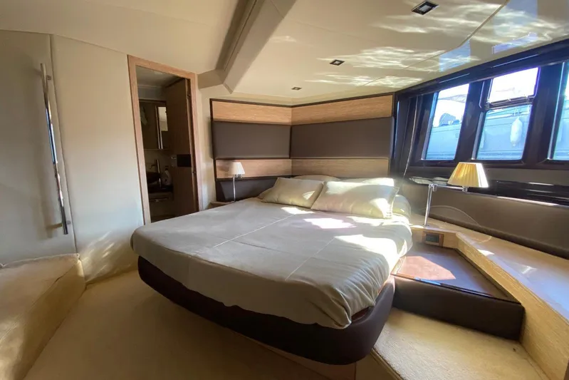  Yacht Photos Pics Luxurious bedroom interior of 2011 Azimut 58 yacht with modern design and ample natural light.