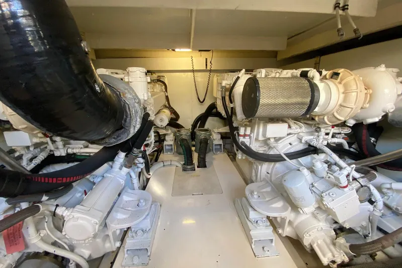  Yacht Photos Pics Engine room of a 2011 Azimut 58 yacht, showcasing dual engines and mechanical components.