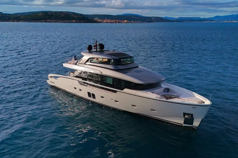 Vinci II Yacht Photos Pics Luxurious 2019 Sanlorenzo SX88 yacht cruising on open sea under cloudy skies.