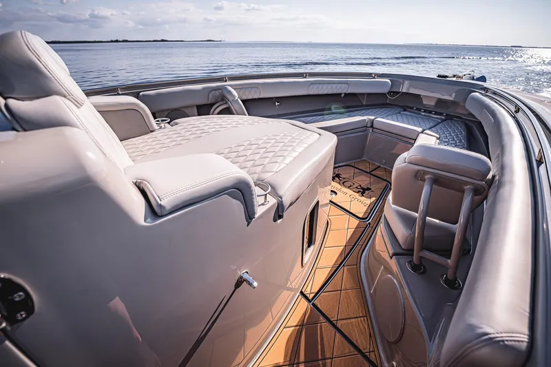 Fifty Shades Of Graydon Yacht Photos Pics Luxurious interior of 2023 HCB 42 Lujo boat with plush seating and ocean view.