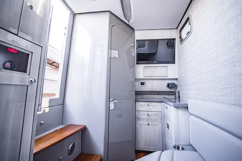 Fifty Shades Of Graydon Yacht Photos Pics Modern interior of 2023 HCB 42 Lujo boat with sleek cabinetry and seating.