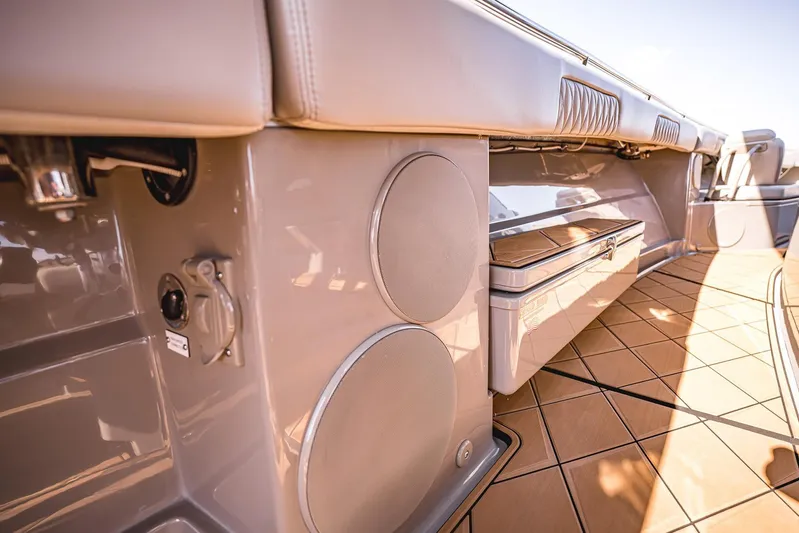 Fifty Shades Of Graydon Yacht Photos Pics 2023 HCB 42 Lujo boat interior with speakers and storage, featuring sleek design and wood flooring.