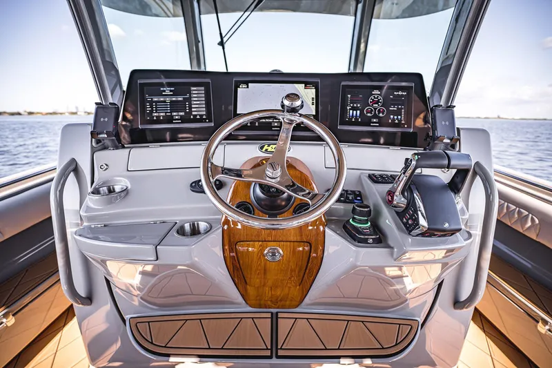 Fifty Shades Of Graydon Yacht Photos Pics Helm of 2023 HCB 42 Lujo boat with advanced navigation controls and displays.