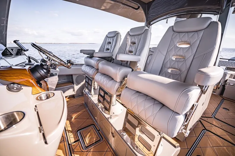 Fifty Shades Of Graydon Yacht Photos Pics Luxurious interior of 2023 HCB 42 Lujo boat with plush seating and elegant design.