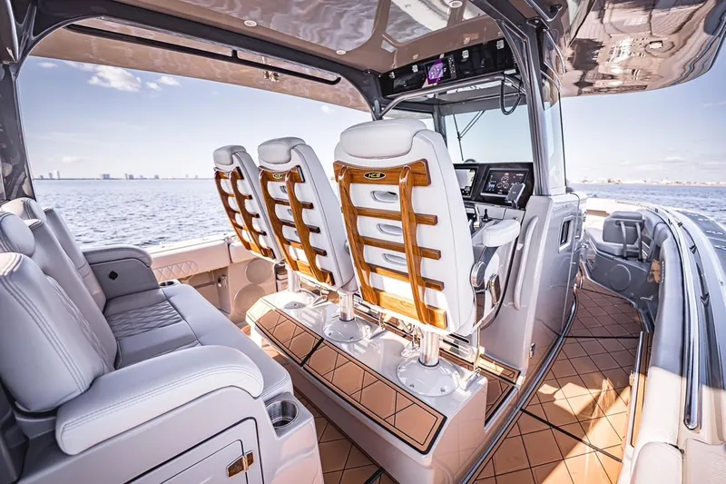 Fifty Shades Of Graydon Yacht Photos Pics Luxurious interior of 2023 HCB 42 Lujo boat with plush seating and advanced controls.