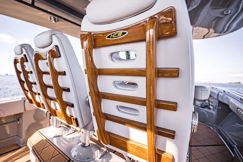 Fifty Shades Of Graydon Yacht Photos Pics Luxury seating on 2023 HCB 42 Lujo boat with elegant wood accents.