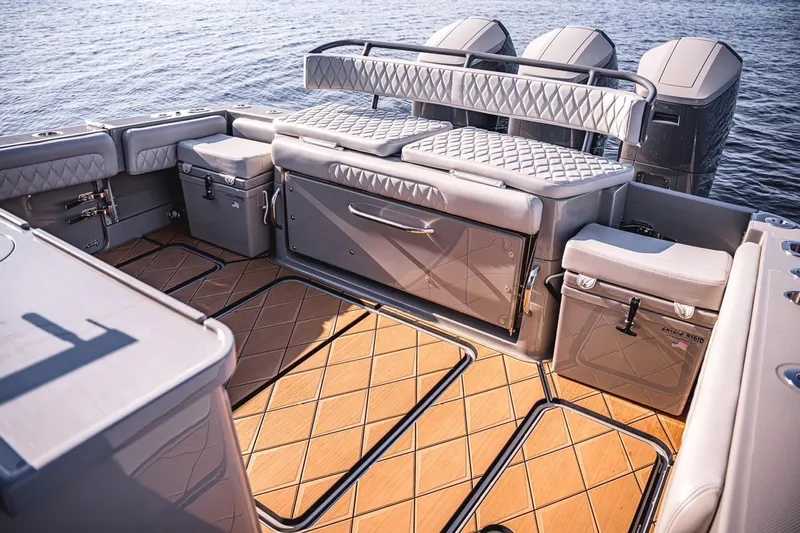 Fifty Shades Of Graydon Yacht Photos Pics 2023 HCB 42 Lujo boat interior with luxurious seating and storage, overlooking calm water.