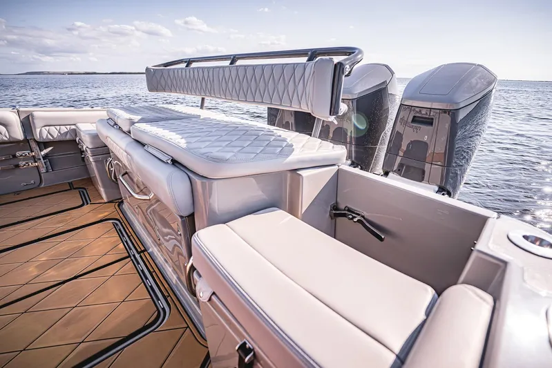 Fifty Shades Of Graydon Yacht Photos Pics Luxurious 2023 HCB 42 Lujo boat interior with plush seating and powerful outboard engines.