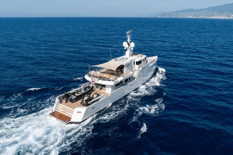 Preference 19 Yacht Photos Pics Luxurious 2011 Tansu Custom yacht cruising on open sea, clear blue water.