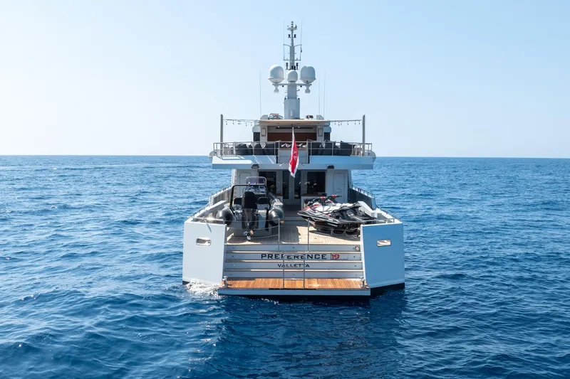 Preference 19 Yacht Photos Pics Luxury Tansu Custom yacht on open sea, 2011 model, with jet skis on deck.