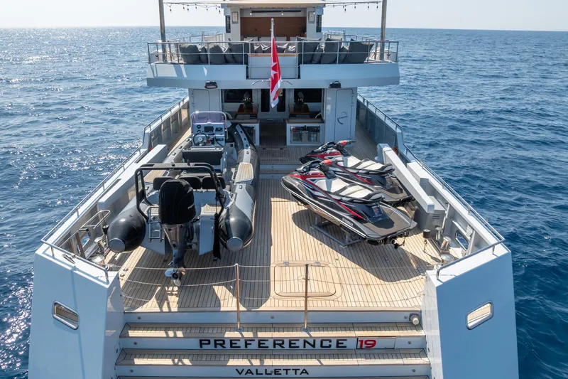 Preference 19 Yacht Photos Pics Luxurious 2011 Tansu Custom yacht deck with jet skis and tender, cruising on open sea.
