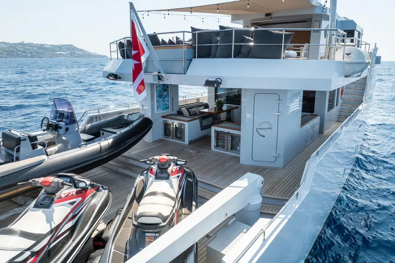 Preference 19 Yacht Photos Pics Luxurious 2011 Tansu Custom yacht with jet skis and spacious deck on open sea.