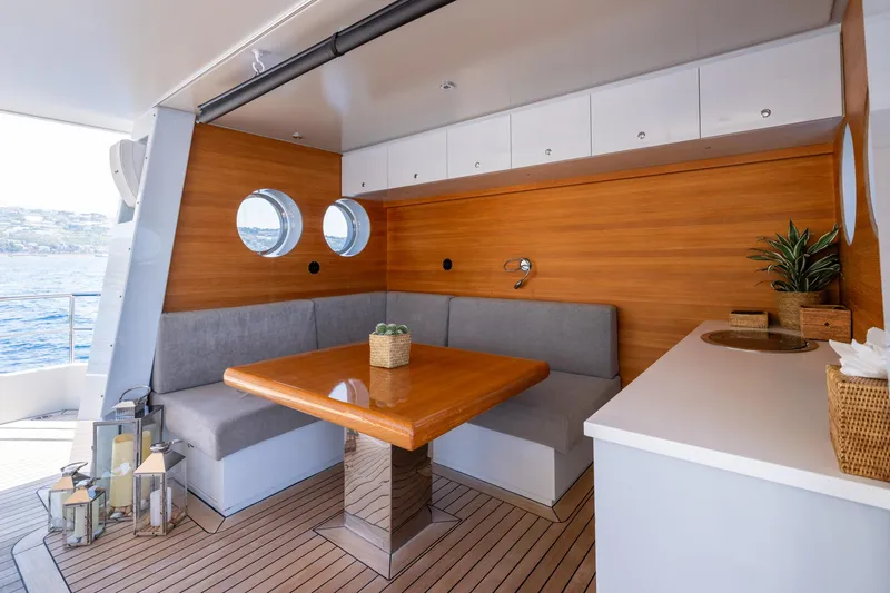 Preference 19 Yacht Photos Pics Luxurious Tansu Custom yacht interior with wooden decor, dining area, and ocean view, 2011 model.