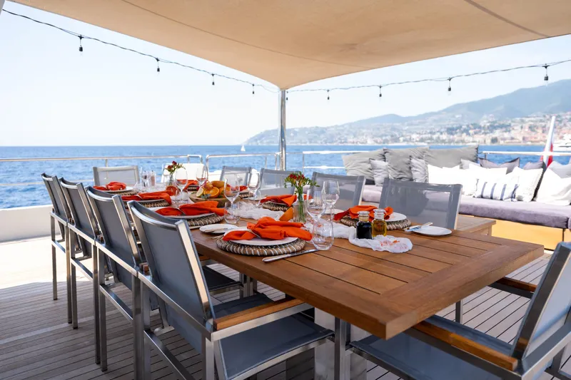 Preference 19 Yacht Photos Pics Luxurious dining setup on 2011 Tansu Custom yacht with ocean view.