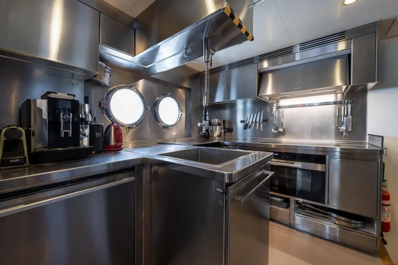 Preference 19 Yacht Photos Pics Modern stainless steel yacht kitchen with appliances, porthole windows, and sleek design, Tansu Custom 2011.