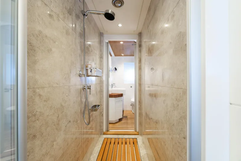 Preference 19 Yacht Photos Pics Luxurious yacht bathroom with marble walls, wooden flooring, and modern shower fixtures, Tansu Custom 2011.