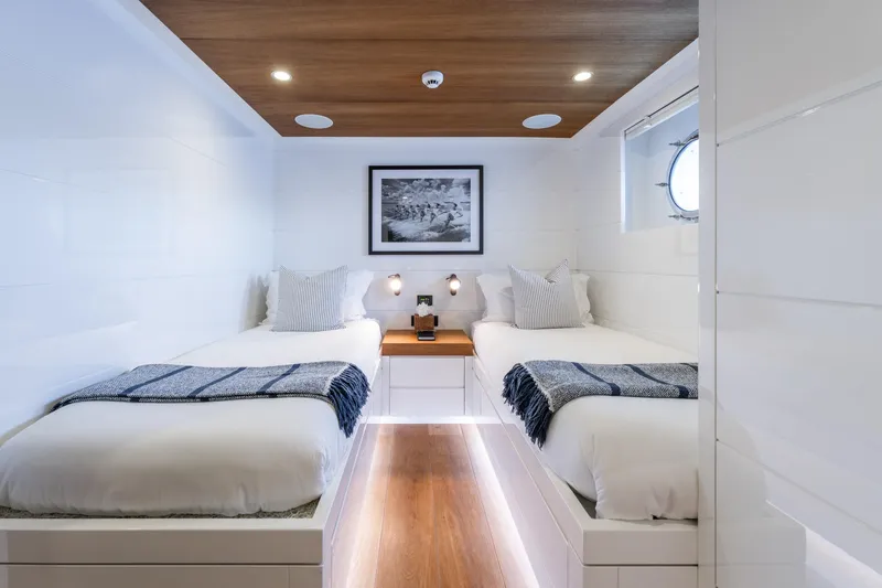 Preference 19 Yacht Photos Pics Luxurious Tansu Custom 2011 yacht cabin with twin beds, modern decor, and wooden accents.