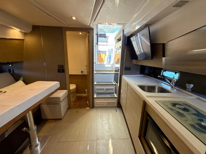 Le Kiki Yacht Photos Pics Interior of 2019 Azimut 40 Verve yacht, featuring modern kitchen and seating area.