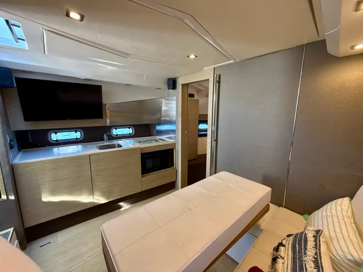 Le Kiki Yacht Photos Pics Interior of 2019 Azimut 40 Verve yacht, featuring modern kitchen and seating area.