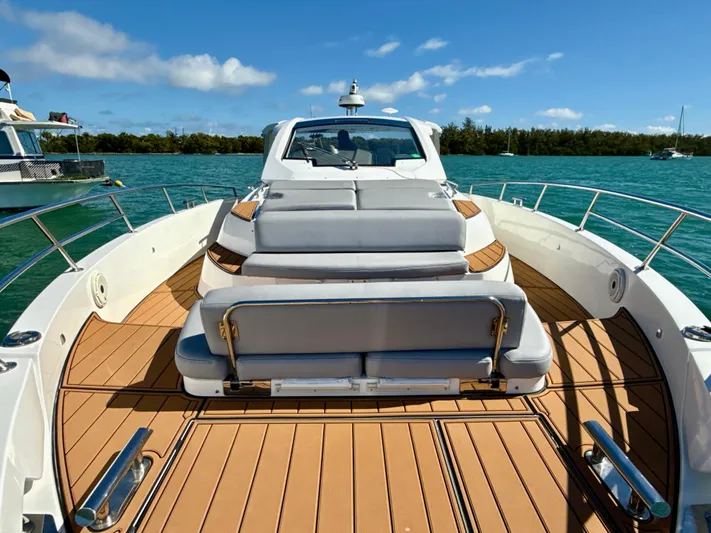 Le Kiki Yacht Photos Pics 2019 Azimut 40 Verve yacht with spacious deck and luxurious seating on a sunny day.
