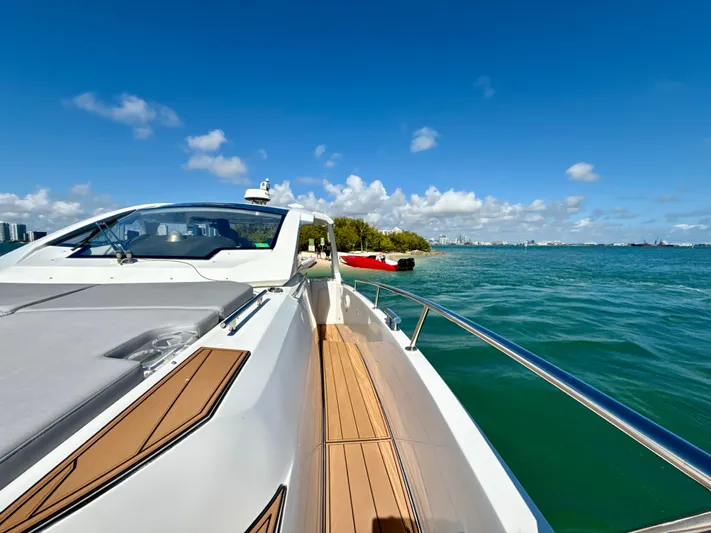Le Kiki Yacht Photos Pics 2019 Azimut 40 Verve yacht cruising on clear blue waters under a sunny sky.