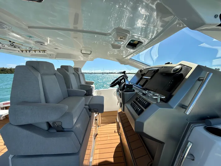 Le Kiki Yacht Photos Pics 2019 Azimut 40 Verve yacht cockpit with modern helm and plush seating.