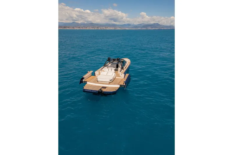  Yacht Photos Pics Luxury Evo R6 yacht on open sea, 2020 model, with scenic coastal backdrop.