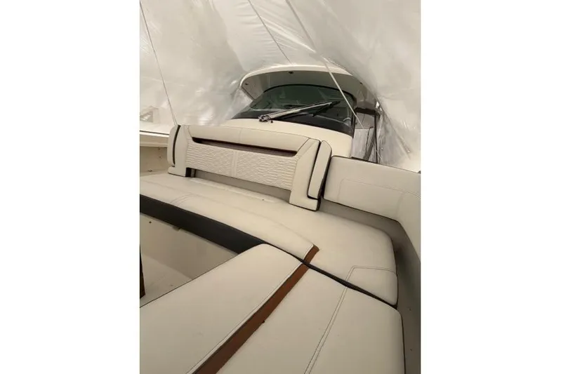  Yacht Photos Pics 2021 Tiara Sport 38 LS boat interior with white seating and protective cover.