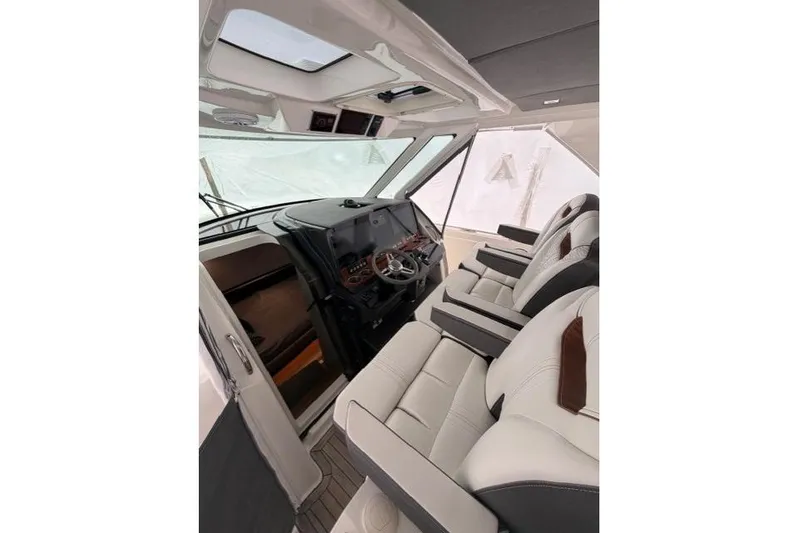  Yacht Photos Pics Interior of 2021 Tiara Sport 38 LS boat with luxurious seating and modern dashboard.
