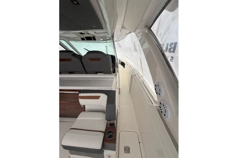  Yacht Photos Pics Interior view of 2021 Tiara Sport 38 LS boat, featuring seating and sleek design.