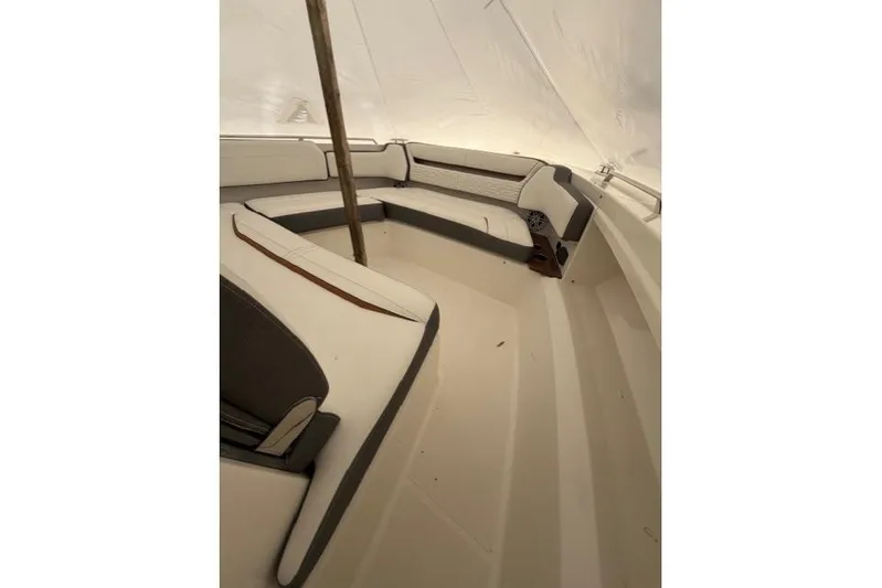  Yacht Photos Pics 2021 Tiara Sport 38 LS boat interior with white cushioned seating.