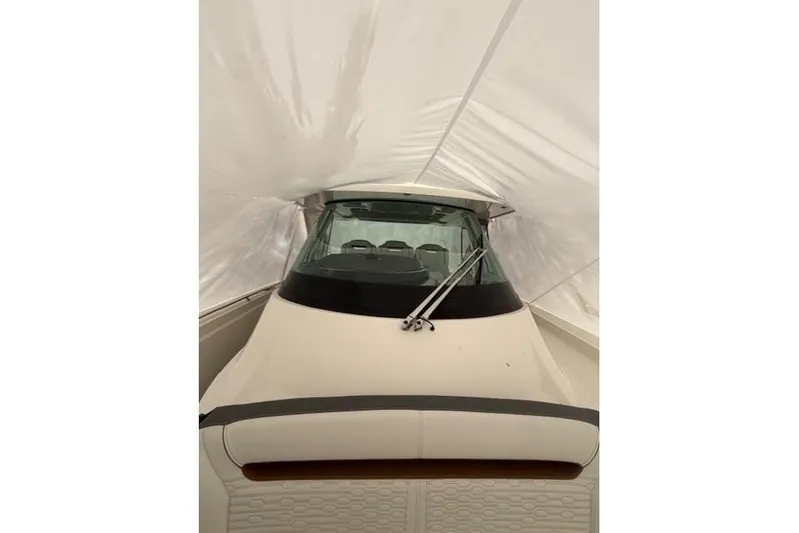  Yacht Photos Pics 2021 Tiara Sport 38 LS boat under protective cover, front view.