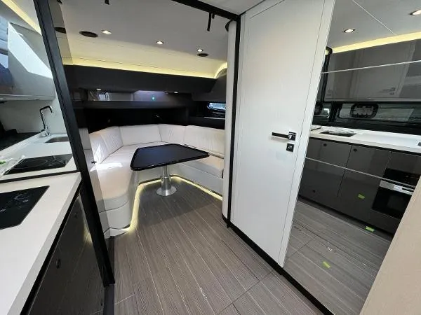 No Name Yacht Photos Pics Modern interior of 2024 Azimut Verve 42 yacht with sleek kitchen and dining area.
