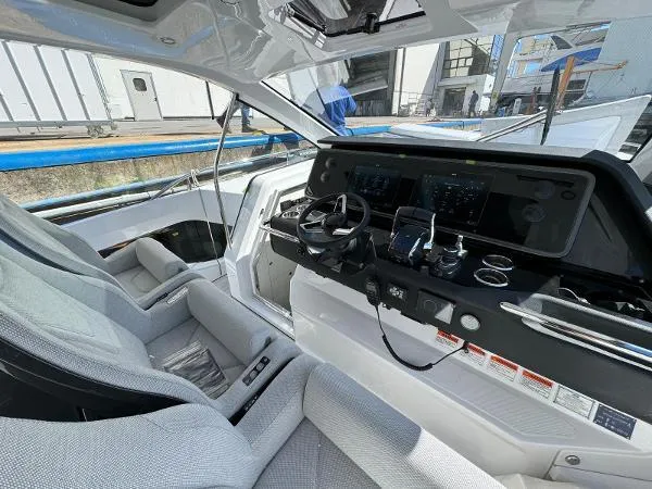 No Name Yacht Photos Pics 2024 Azimut Verve 42 yacht cockpit with modern controls and luxurious seating.