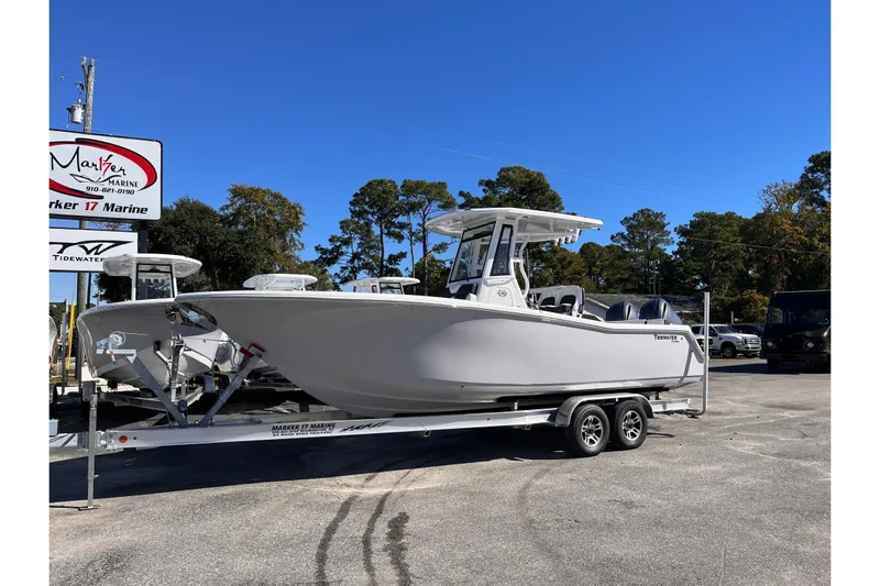  Yacht Photos Pics 2026 Tidewater 256 LXF boat on trailer at Marker 17 Marine dealership.