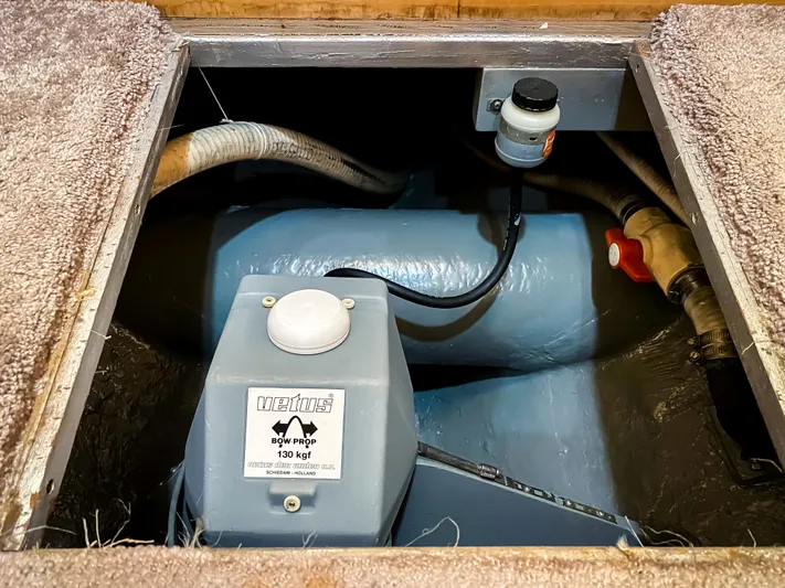 Boom Yacht Photos Pics Engine compartment of a 1999 Navigator 5800 boat, featuring mechanical components and hoses.