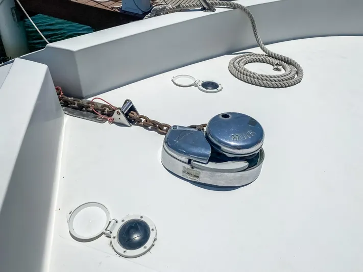 Boom Yacht Photos Pics Anchor winch on 1999 Navigator 5800 yacht deck with rope and chain.