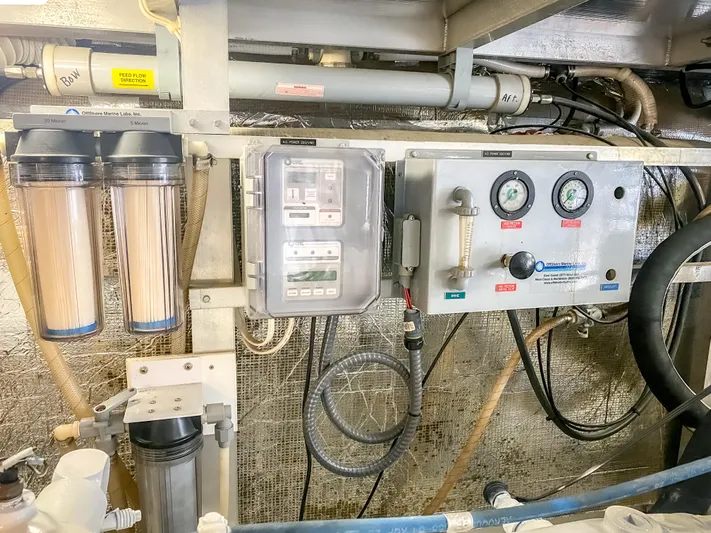 Boom Yacht Photos Pics Control panel and filtration system in a 1999 Navigator 5800 yacht engine room.