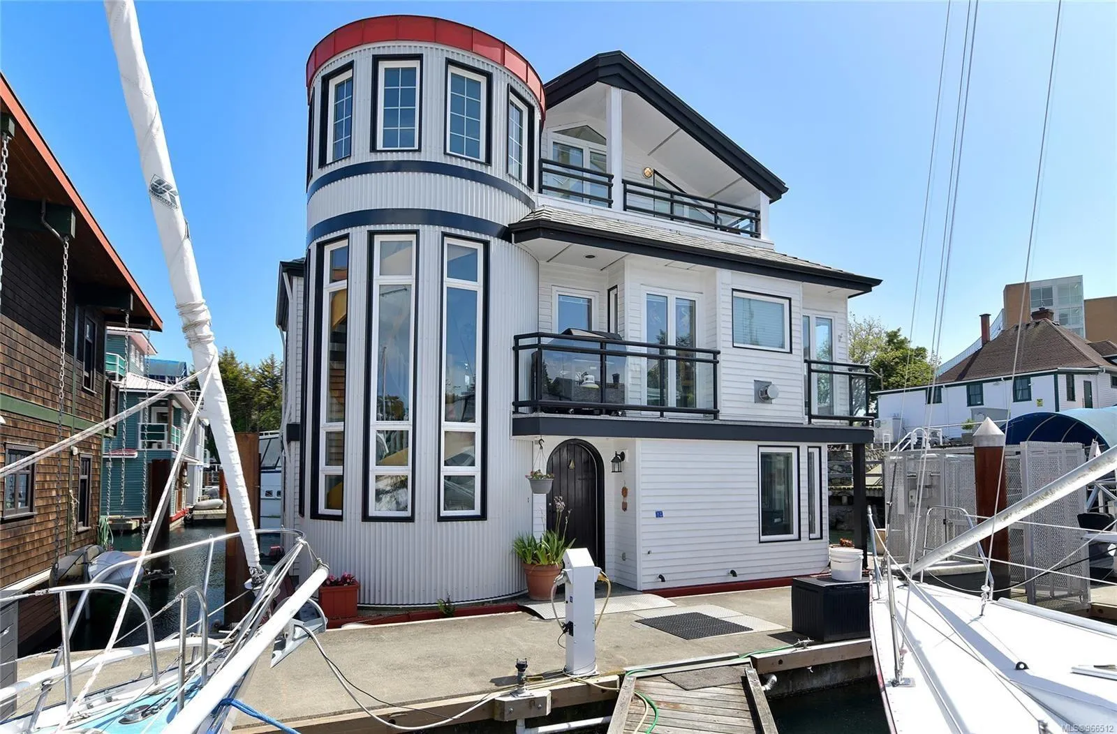 Custom 2005 float home with modern design, large windows, and waterfront location.